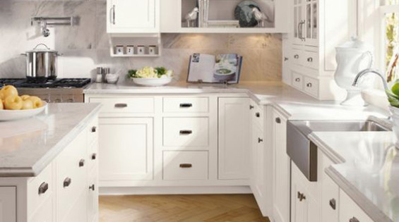 A traditional new kitchen with classic light tones and natural lighting