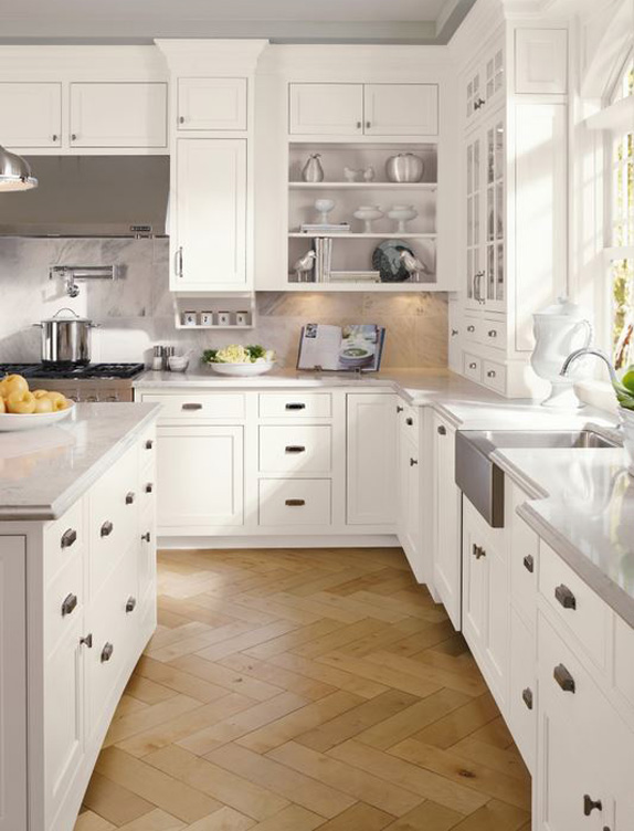 A traditional new kitchen with classic light tones and natural lighting