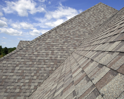 Residential roofing replacement with grey and brown shingles