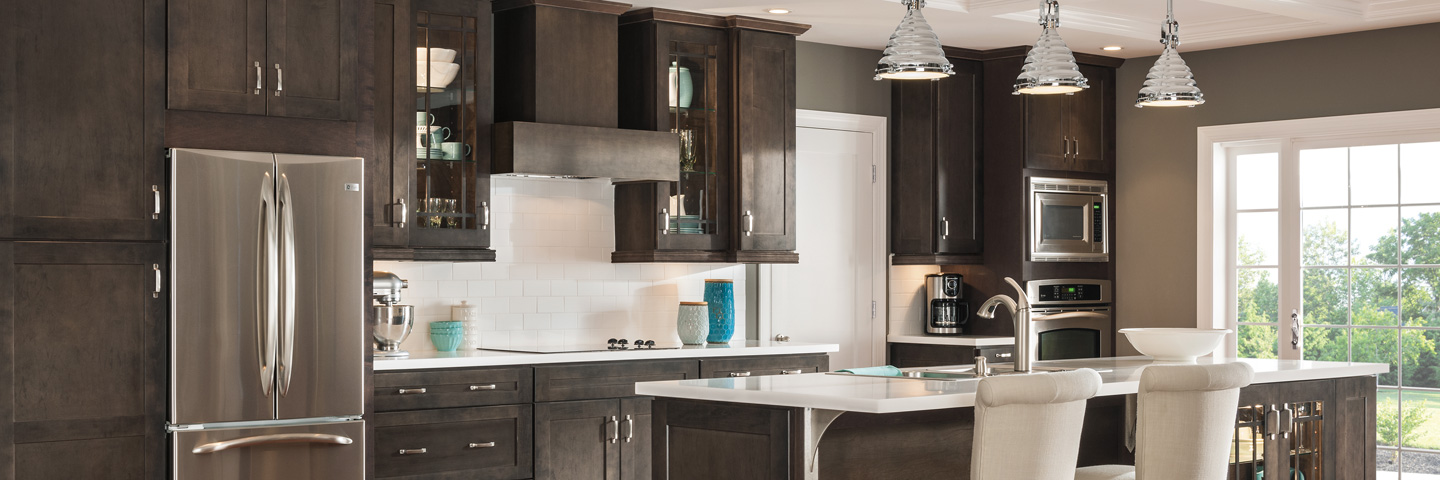 Open concept kitchen with brown kitchen cabinets